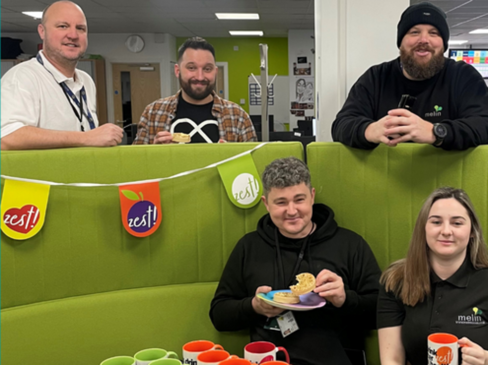 Staff enjoying our coffee morning with our new mugs to help encourage people to talk about their emotions
