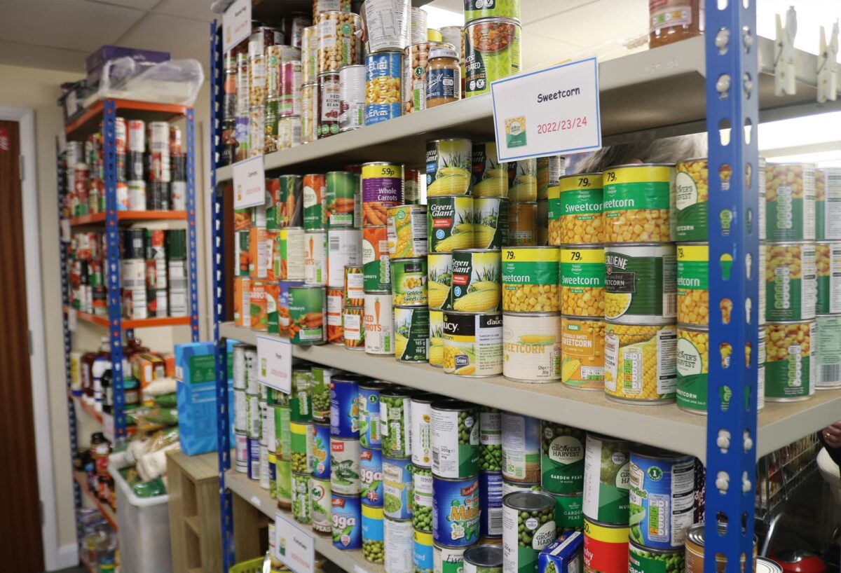 The full shelves of tinned food at the foodbank